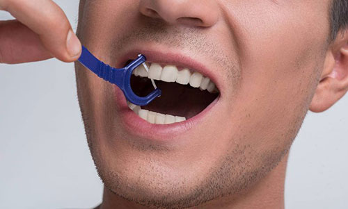 طرز استفاده از نخ دندان